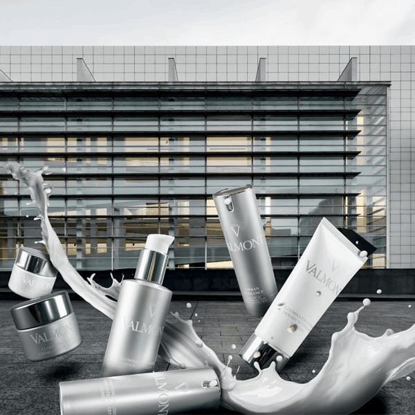 Vials of Valmont Facial Cremes being swished in water