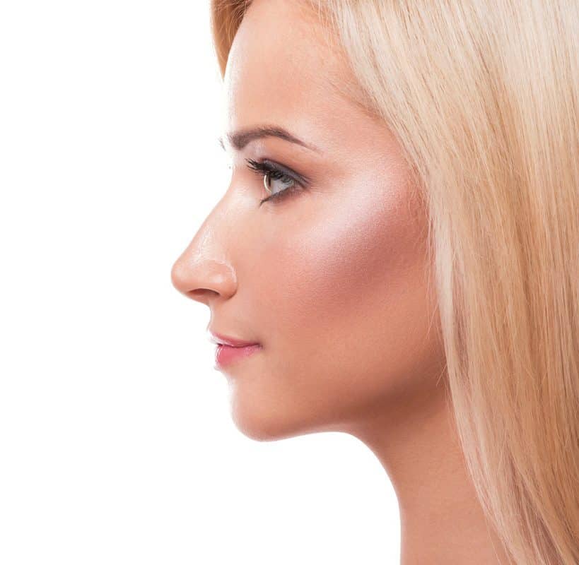 Beautiful Blonde Woman on the right side with a white Background