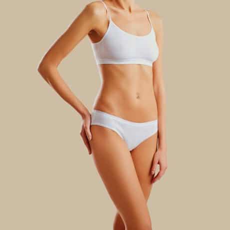 caucasian or asian womans body on a tan background