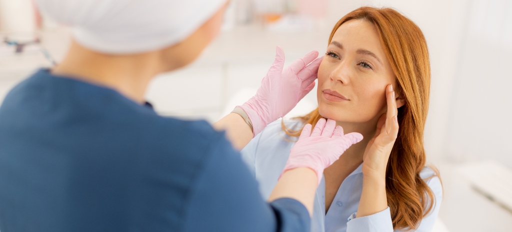 In a tranquil setting, a talented surgeon assesses a client’s features to provide a personalized facelift that enhances their natural beauty and confidence.
