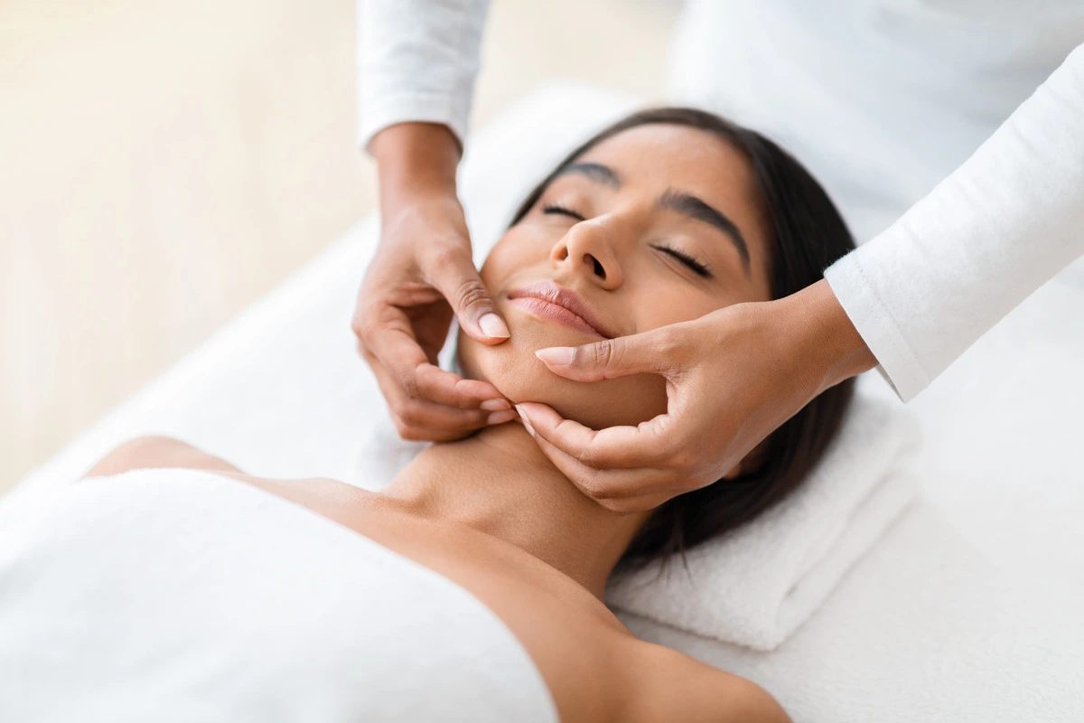 wellness - non-surgical treatments - female getting facial treatment