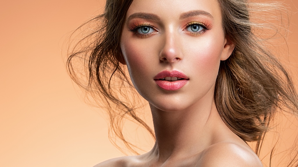 Portrait of a beautiful young woman with a long hair.