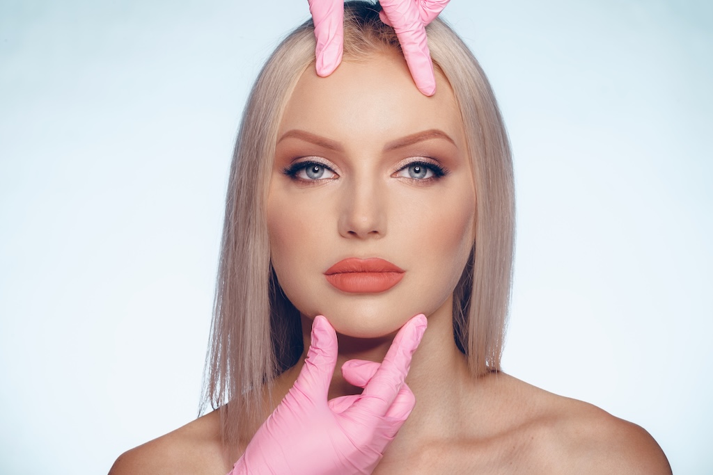 Portrait of young woman being evaluated for plastic surgery