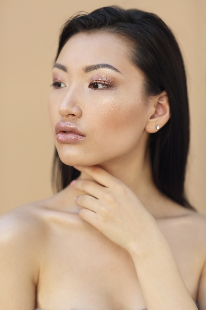 Portrait of beautiful model with long dark hair.