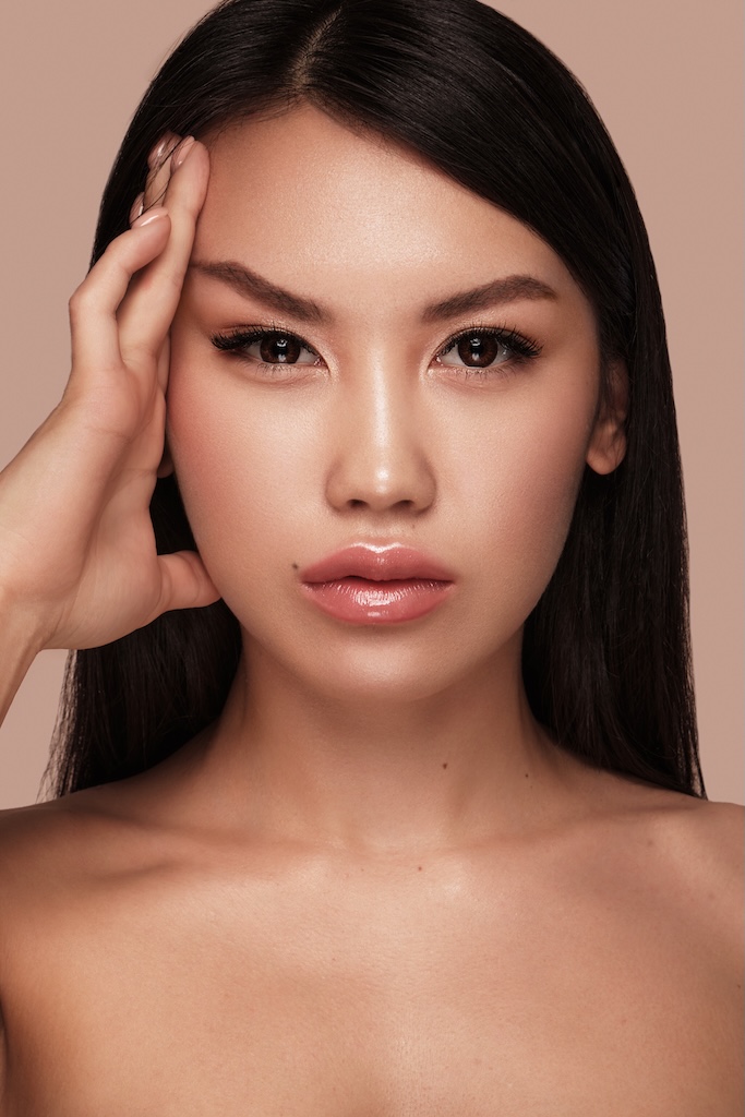 Beautiful delicate woman with nude makeup and perfect skin.