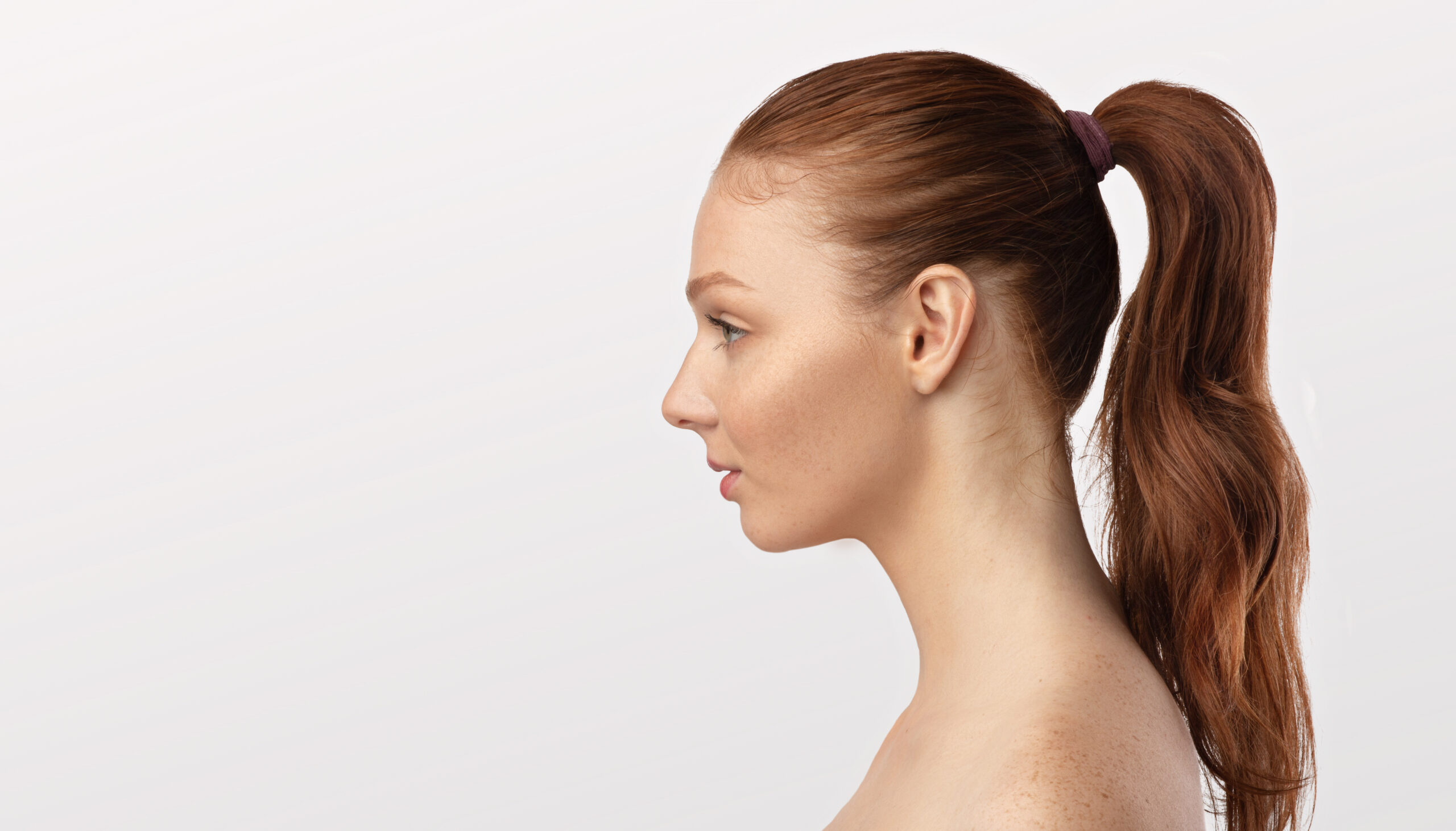 Deep Plane Facelift profile of woman with red hair in ponytail 2026 03 24 02 53 56 utc scaled